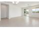 Bright living room with sliding glass doors leading to the backyard and tile flooring at 25332 N 133Rd Ave, Peoria, AZ 85383