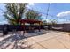 Wide backyard view with seating area, BBQ grill and concrete patio with shadows at 2635 W Atlanta Ave, Phoenix, AZ 85041