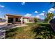 View of the house, patio, lawn, and hammock in a spacious backyard at 2635 W Atlanta Ave, Phoenix, AZ 85041