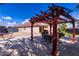 Backyard features a pergola over a dining table for relaxed outdoor living at 2635 W Atlanta Ave, Phoenix, AZ 85041