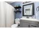 The bathroom features a shower/tub combo and a vanity with quartz countertops at 2635 W Atlanta Ave, Phoenix, AZ 85041