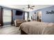 This spacious bedroom features wood-look floors, ceiling fan, and vanity area at 2635 W Atlanta Ave, Phoenix, AZ 85041