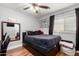 The bedroom features wood floors and a ceiling fan at 2635 W Atlanta Ave, Phoenix, AZ 85041