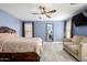This spacious bedroom features wood-look floors, ceiling fan, and comfortable furnishings at 2635 W Atlanta Ave, Phoenix, AZ 85041