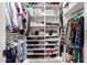 The walk-in closet has custom shelving and ample space for storage at 2635 W Atlanta Ave, Phoenix, AZ 85041