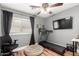 This exercise room includes a ceiling fan and lots of natural light at 2635 W Atlanta Ave, Phoenix, AZ 85041