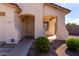 A welcoming front entryway featuring a secure screen door and a charming arched porch at 2635 W Atlanta Ave, Phoenix, AZ 85041
