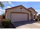 Charming single story home with a two car garage, desert landscaping, and a cozy front porch at 2635 W Atlanta Ave, Phoenix, AZ 85041