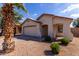 Charming single story home with a two car garage, desert landscaping, and a cozy front porch at 2635 W Atlanta Ave, Phoenix, AZ 85041