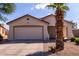 Charming single story home with a two car garage, desert landscaping, and a cozy front porch at 2635 W Atlanta Ave, Phoenix, AZ 85041