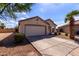 Charming single story home with a two car garage, desert landscaping, and a cozy front porch at 2635 W Atlanta Ave, Phoenix, AZ 85041