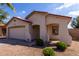 Charming single story home with a two car garage, desert landscaping, and a cozy front porch at 2635 W Atlanta Ave, Phoenix, AZ 85041