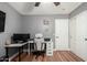 The home office features wood floors and a ceiling fan at 2635 W Atlanta Ave, Phoenix, AZ 85041