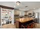 Spacious pantry with custom shelving for optimal storage, conveniently located near the kitchen island at 2635 W Atlanta Ave, Phoenix, AZ 85041