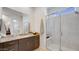 Modern bathroom featuring a granite countertop and glass shower enclosure at 26355 N 79Th Dr, Peoria, AZ 85383
