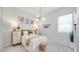 Charming bedroom with a statement ceiling, decorative wall art, and plenty of natural light at 26355 N 79Th Dr, Peoria, AZ 85383