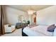 Cozy bedroom featuring a crystal chandelier and stylish decor at 26355 N 79Th Dr, Peoria, AZ 85383