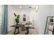 Cozy home office featuring a modern desk, comfortable chair, and a shelf for books with natural lighting at 26355 N 79Th Dr, Peoria, AZ 85383