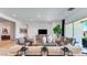 Bright living room featuring stylish furniture, a modern TV, and large windows bringing in natural light at 26355 N 79Th Dr, Peoria, AZ 85383
