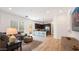 Open concept living room and kitchen area with hardwood floors at 26355 N 79Th Dr, Peoria, AZ 85383