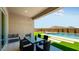 Outdoor patio boasts a dining area, pool and lush landscaping at 26355 N 79Th Dr, Peoria, AZ 85383