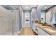 Elegant bathroom with a glass-enclosed shower, double vanity, and modern fixtures at 26391 N 79Th Dr, Peoria, AZ 85383