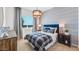 Well-lit bedroom with stylish wallpaper and comfortable furnishings for relaxing and restful nights at 26391 N 79Th Dr, Peoria, AZ 85383
