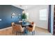 Stylish dining room with modern lighting, a round table, and a comfortable seating arrangement at 26391 N 79Th Dr, Peoria, AZ 85383