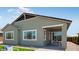 Charming home featuring a covered patio, grey stucco, manicured lawn, and mountain views at 26391 N 79Th Dr, Peoria, AZ 85383