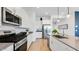 Modern kitchen featuring stainless steel appliances, white cabinets, and a spacious layout at 26391 N 79Th Dr, Peoria, AZ 85383