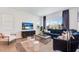 Elegant living room featuring modern decor, large windows, and comfortable seating at 26391 N 79Th Dr, Peoria, AZ 85383