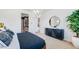 Bright bedroom with ensuite bathroom featuring a stylish chandelier and ample closet space at 26391 N 79Th Dr, Peoria, AZ 85383