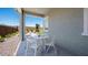 Comfortable patio with chairs and table, perfect for outdoor dining and entertaining at 26391 N 79Th Dr, Peoria, AZ 85383