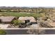 Beautiful aerial view of the home, situated on a golf course with mountain views at 3045 W Feather Sound Dr, Phoenix, AZ 85086