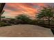Charming back patio with desert landscaping, outdoor seating, and stunning sunset views at 3045 W Feather Sound Dr, Phoenix, AZ 85086