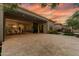 Spacious backyard featuring a covered patio, outdoor seating, and folding doors opening to the home's interior at 3045 W Feather Sound Dr, Phoenix, AZ 85086