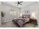 Cozy bedroom with ceiling fan, plantation shutters, and neutral decor at 3045 W Feather Sound Dr, Phoenix, AZ 85086