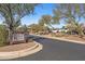 Scenic community entrance with a sign directing to the golf shop, restaurant, and fitness center, offering convenient amenities at 3045 W Feather Sound Dr, Phoenix, AZ 85086