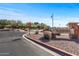 Welcoming entrance to Ironwood Anthem Country Club, featuring a stone sign and well-maintained landscaping at 3045 W Feather Sound Dr, Phoenix, AZ 85086