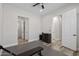 Bright workout room featuring a Tonal home gym and access to an ensuite bathroom for post-workout convenience at 3045 W Feather Sound Dr, Phoenix, AZ 85086