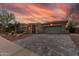 Charming home exterior boasting a paved driveway, desert landscaping and attached two car garage at 3045 W Feather Sound Dr, Phoenix, AZ 85086