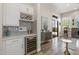 A modern kitchen with a wine refrigerator and custom backsplash at 3045 W Feather Sound Dr, Phoenix, AZ 85086