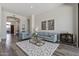 Open-concept living room with wood-look flooring and view of foyer and entry at 3045 W Feather Sound Dr, Phoenix, AZ 85086