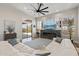 An open-concept living room featuring a fireplace, sliding glass door, and plush seating at 3045 W Feather Sound Dr, Phoenix, AZ 85086