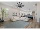 Spacious living room with a modern fireplace, and open to the gourmet kitchen at 3045 W Feather Sound Dr, Phoenix, AZ 85086