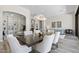 Inviting living space featuring a dining area, a comfortable sofa, and stylish decor at 3045 W Feather Sound Dr, Phoenix, AZ 85086