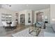 Open-concept living space with elegant dining, seating, and seamless flow throughout at 3045 W Feather Sound Dr, Phoenix, AZ 85086