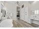 Main bathroom with soaking tub, dual vanities, and makeup vanity at 3045 W Feather Sound Dr, Phoenix, AZ 85086