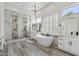 Stunning main bathroom featuring dual vanities, soaking tub, and walk-in shower at 3045 W Feather Sound Dr, Phoenix, AZ 85086