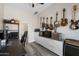 Office with white walls and shutters, featuring guitars hung on the wall and views of an adjacent bathroom at 3045 W Feather Sound Dr, Phoenix, AZ 85086